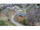 Aerial shot exhibits the property's setting within a neighborhood, highlighting mature trees at 109 Dogwood Dr, Hickory, NC 28601