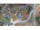 Aerial view of home nestled among trees, showcasing its driveway and surrounding landscape at 109 Dogwood Dr, Hickory, NC 28601
