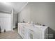 Elegant bathroom with double vanity sinks, white cabinets, and modern fixtures at 109 Dogwood Dr, Hickory, NC 28601