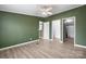 Comfortable bedroom with modern flooring, a ceiling fan, and natural light at 109 Dogwood Dr, Hickory, NC 28601