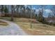 Exterior gravel driveway view with some trees and nature surrounding it at 109 Dogwood Dr, Hickory, NC 28601