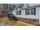 Exterior front view of a home with stairs, a porch, and a yard at 109 Dogwood Dr, Hickory, NC 28601