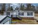 Exterior front view of a home with stairs, a porch, and a yard at 109 Dogwood Dr, Hickory, NC 28601