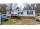 Exterior front view of a home with stairs, a porch, and a yard at 109 Dogwood Dr, Hickory, NC 28601