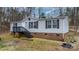 Charming single-story home with vinyl siding, brick foundation, and inviting front stairs to the door at 109 Dogwood Dr, Hickory, NC 28601