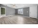 Bright, open living area with laminate flooring, neutral gray walls and ample natural light at 109 Dogwood Dr, Hickory, NC 28601
