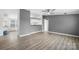 Open living space featuring modern gray walls and stylish laminate flooring with open kitchen view at 109 Dogwood Dr, Hickory, NC 28601