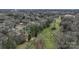 Aerial view of a neighborhood with mature trees, winding walking paths, and a stream at 1101 Roundknob Ave, Salisbury, NC 28144