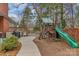 Backyard featuring a playset, a deck with a grill, and a spacious, grassy area perfect for families at 1101 Roundknob Ave, Salisbury, NC 28144