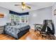 Bedroom with wood floors, study area, and a large window at 1101 Roundknob Ave, Salisbury, NC 28144