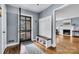Inviting foyer with stylish decor, featuring a coat rack bench and a view into the living room at 1101 Roundknob Ave, Salisbury, NC 28144