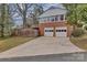 Detached two-car garage featuring a long driveway, offering ample parking and storage space at 1101 Roundknob Ave, Salisbury, NC 28144