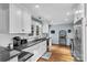 Bright kitchen featuring white cabinets, granite countertops and stainless steel appliances at 1101 Roundknob Ave, Salisbury, NC 28144