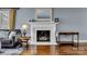 Cozy living room with a fireplace, hardwood floors, and neutral paint at 1101 Roundknob Ave, Salisbury, NC 28144