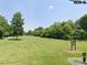 Neighborhood park featuring a vast expanse of green space, mature trees, and walking path at 1101 Roundknob Ave, Salisbury, NC 28144