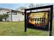 Community entrance sign with 'Forest Hills' branding beside a white brick home on a sunny lawn at 1101 Roundknob Ave, Salisbury, NC 28144