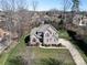 Beautiful two-story brick home with a large yard, mature trees, and a basketball hoop at 11243 Home Place Ln, Mint Hill, NC 28227
