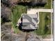 Stunning aerial view of home with a lush lawn, mature trees, and a long driveway at 11243 Home Place Ln, Mint Hill, NC 28227