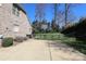 Home's backyard with paved patio and an adjacent basketball court at 11243 Home Place Ln, Mint Hill, NC 28227