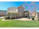 The patio features an outdoor cooking area and views of a brick home at 11243 Home Place Ln, Mint Hill, NC 28227