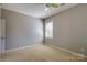 Bright bedroom with neutral walls, carpet flooring, and natural light at 11243 Home Place Ln, Mint Hill, NC 28227