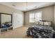 Comfortable bedroom features a stylish chandelier and decor at 11243 Home Place Ln, Mint Hill, NC 28227