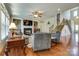 Spacious living room with hardwood floors, a fireplace, built-in shelving, and a staircase at 11243 Home Place Ln, Mint Hill, NC 28227