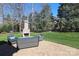 Backyard patio with an outdoor fireplace and comfortable seating arrangement at 11243 Home Place Ln, Mint Hill, NC 28227