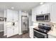 Modern kitchen featuring white cabinets, stainless steel appliances, and granite countertops at 1165 Golden Maple Ln, Chester, SC 29706