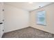 This naturally lit bedroom features a neutral color palette and plush carpeting at 117 Mountain View St, Gastonia, NC 28052