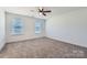 Carpeted bedroom is spacious with two windows at 117 Mountain View St, Gastonia, NC 28052