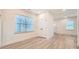 Bright bedroom with hardwood floors, a window, and a spacious closet at 117 Mountain View St, Gastonia, NC 28052
