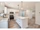 Spacious kitchen with modern appliances, white cabinets, and a central island at 117 Mountain View St, Gastonia, NC 28052