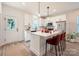 Modern kitchen featuring stainless steel appliances, a central island, and sleek white cabinetry at 117 Mountain View St, Gastonia, NC 28052