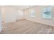 Spacious living area featuring modern flooring, natural light, and a fresh, clean design at 117 Mountain View St, Gastonia, NC 28052