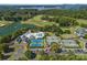 Aerial view showcasing resort-style amenities with swimming pools, tennis courts, and lake access at 130 Brick Kiln Way, Mooresville, NC 28117