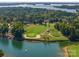 Aerial view of waterfront homesites featuring lush landscaping, golf course and lake views at 130 Brick Kiln Way, Mooresville, NC 28117