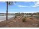 Backyard view of the lake and private dock with walkway at 130 Brick Kiln Way, Mooresville, NC 28117