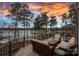 Backyard patio featuring a lakeside view with comfortable outdoor seating arrangements and scenic vistas at 130 Brick Kiln Way, Mooresville, NC 28117