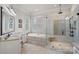 Bathroom featuring a tub, glass shower, and vanity with double sinks at 130 Brick Kiln Way, Mooresville, NC 28117