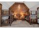 Fun bunk room with wood paneled walls and four rustic wooden bunk beds at 130 Brick Kiln Way, Mooresville, NC 28117