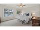Bright bedroom with calming colors, lake views, and comfortable furniture at 130 Brick Kiln Way, Mooresville, NC 28117