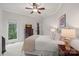 Bright bedroom with a lake view window and access to the outdoor balcony at 130 Brick Kiln Way, Mooresville, NC 28117