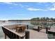 Lakeside boat dock with outdoor seating, offering serene views and access to water activities at 130 Brick Kiln Way, Mooresville, NC 28117