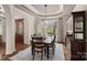 Elegant dining room featuring a chandelier, large window, and hardwood floors at 130 Brick Kiln Way, Mooresville, NC 28117