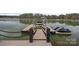 Private dock with boat and jet ski lifts on a serene lake at 130 Brick Kiln Way, Mooresville, NC 28117