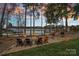 Lakeside fire pit area with comfortable seating, perfect for relaxing evenings by the water at 130 Brick Kiln Way, Mooresville, NC 28117