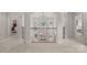Elegant foyer showcasing the second-floor landing overlooking living area with lake views at 130 Brick Kiln Way, Mooresville, NC 28117