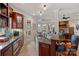 Gourmet kitchen with granite countertops, tile floors, a breakfast bar, and custom cabinetry at 130 Brick Kiln Way, Mooresville, NC 28117