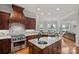 Spacious kitchen with granite countertops, stainless steel appliances, and lake views at 130 Brick Kiln Way, Mooresville, NC 28117